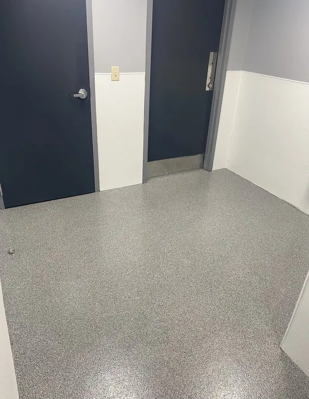 Entry vestibule — clean edges around jambs and thresholds — epoxy flake flooring by Vibrant Painting, Greenville SC