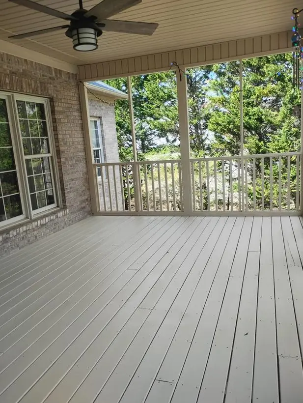 Porch floor — decking, rails, and screen frame — exterior painting by Vibrant Painting, Greenville SC