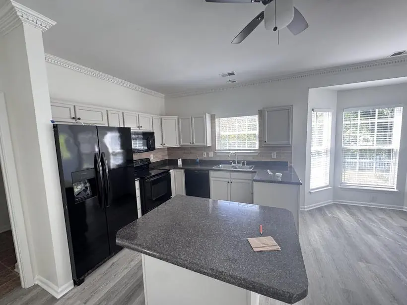 Kitchen — cabinets refinished, walls & trim — whole-home repaint by Vibrant Painting, Greenville SC
