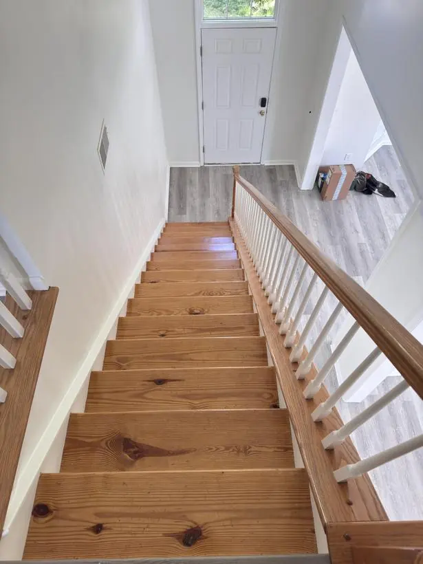Staircase — risers, balusters, and walls — whole-home repaint by Vibrant Painting, Greenville SC