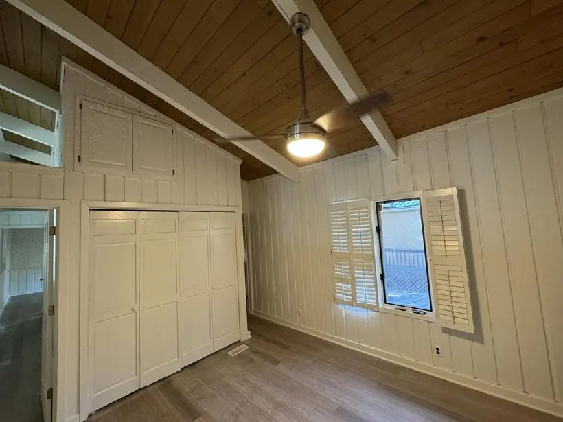 Bedroom & closet — built-in doors and paneling — lakefront home repaint by Vibrant Painting, Greenville SC