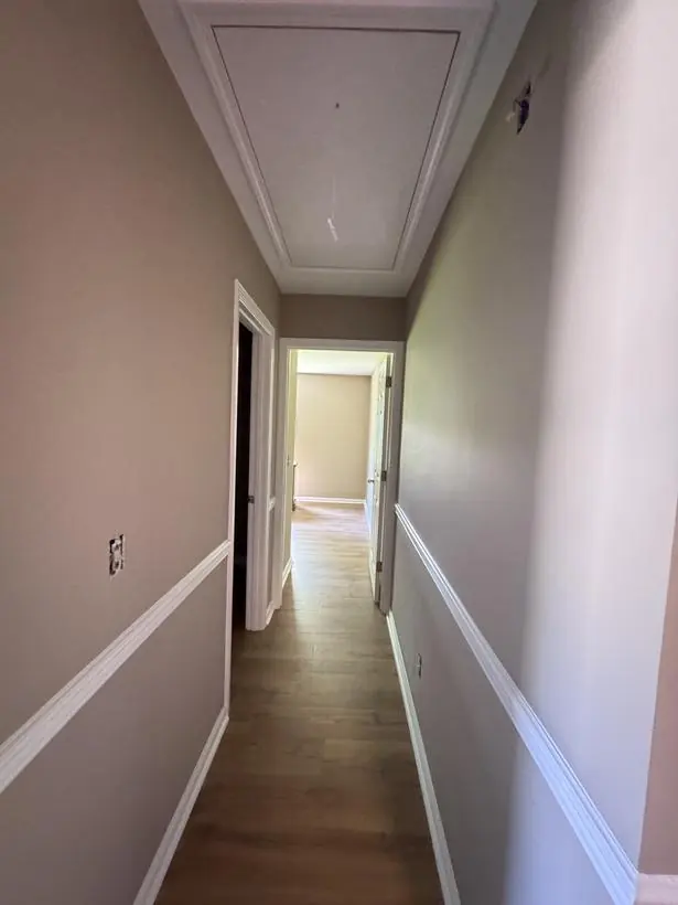 Hallway — walls, chair rail & baseboards — interior repaint by Vibrant Painting, Greenville SC